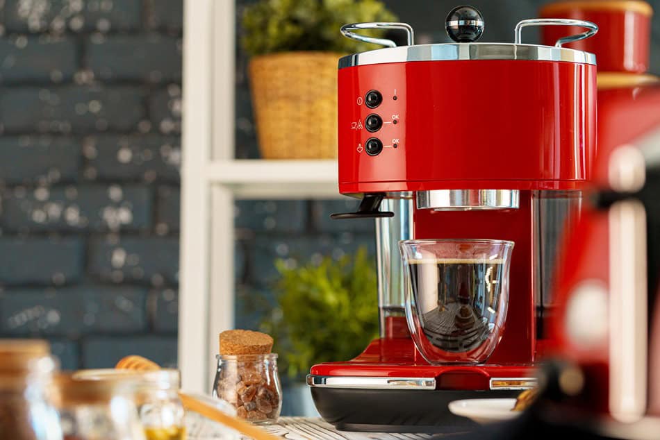 red coffee machine with a glass on kitchen counter 2025 02 24 22 44 33 utc