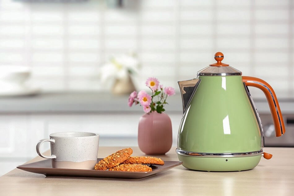 stylish electrical kettle cup and cookies on tabl 2026 02 25 00 19 54 utc